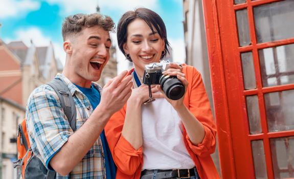 Man and woman looking at camera after taking a photo