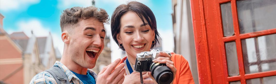 Man and woman looking at camera after taking a photo