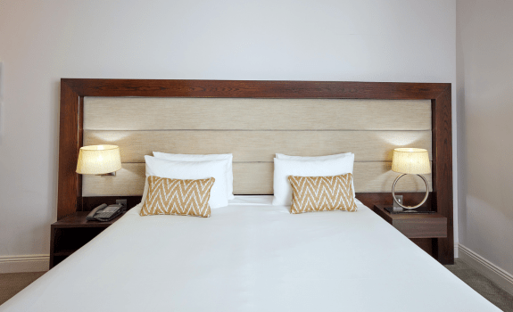 Close up of king bed in executive room