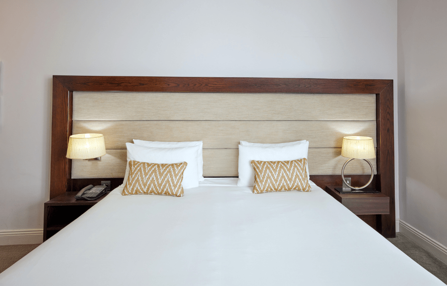 Close up of king bed in executive room