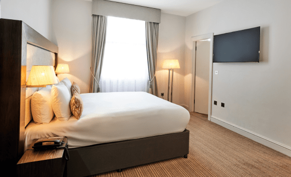 Bed and TV in junior suite