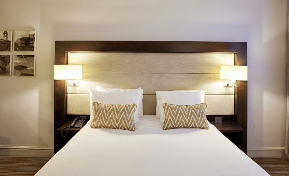 Close up of double bed with pillows