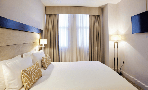 Double bed, window and TV