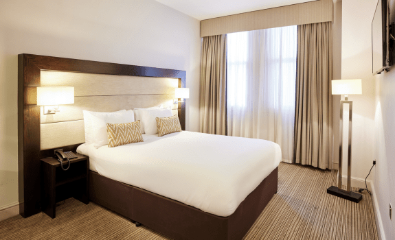 Double bed in double bedroom at Thistle Holborn