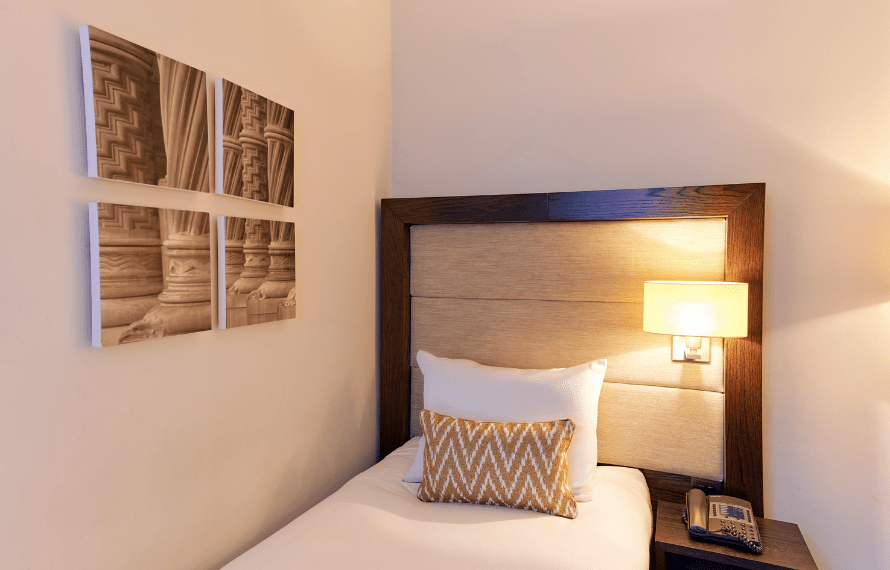 Close up of dingle bed and art on the wall