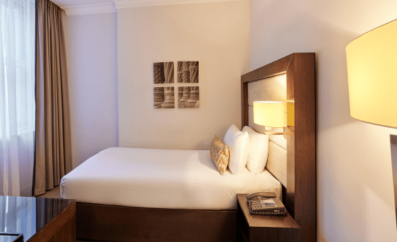 Single bed and art on the wall