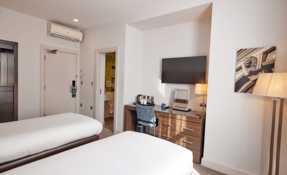 View of the desk and TV area in twin bedroom