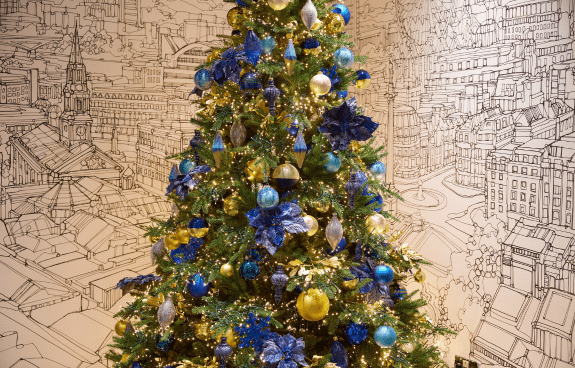Christmas tree with blue and gold ornaments