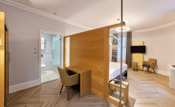 Desk area behind bed