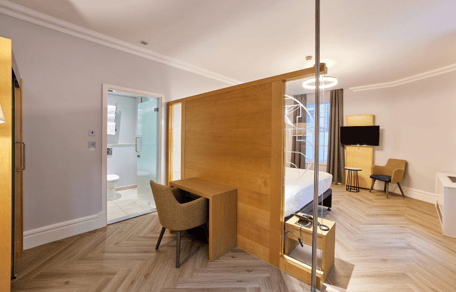 Desk area behind bed