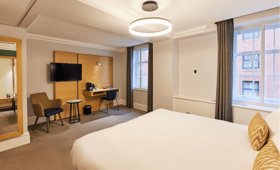 King bed with view of desk area in deluxe king bedroom