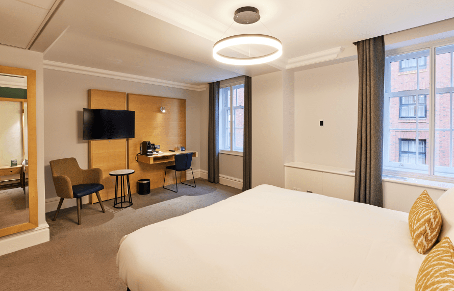 King bed with view of desk area in deluxe king bedroom