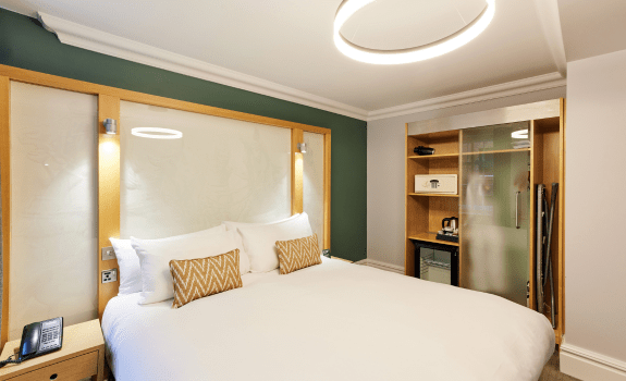 Deluxe king bedroom with king bed, wardrobe and bedside tables