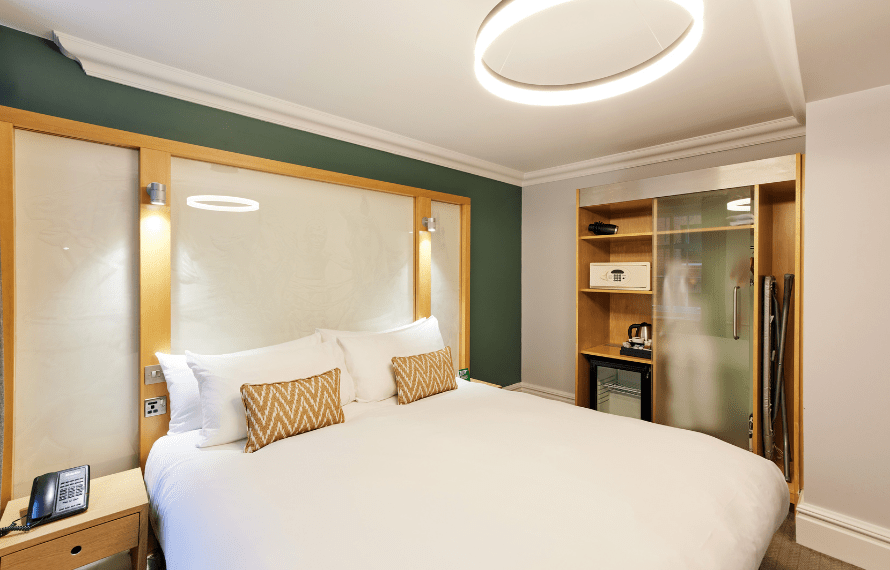 Deluxe king bedroom with king bed, wardrobe and bedside tables