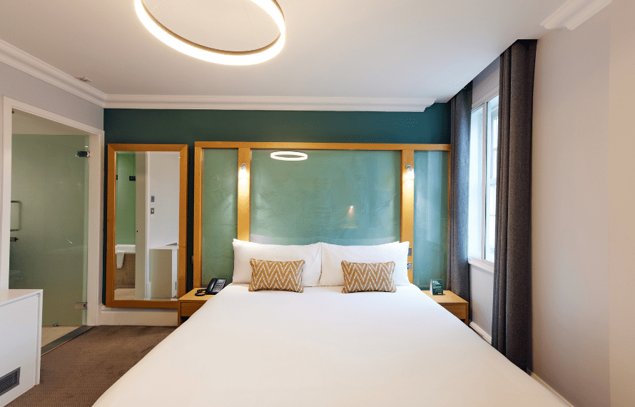 View of double bed from the feet of the bed