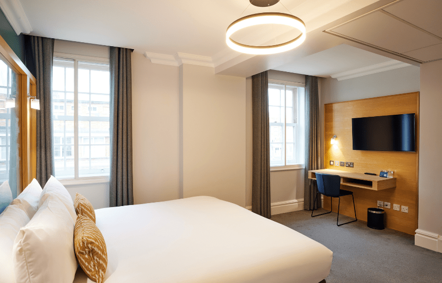 Double bedroom with bed, windows and desk