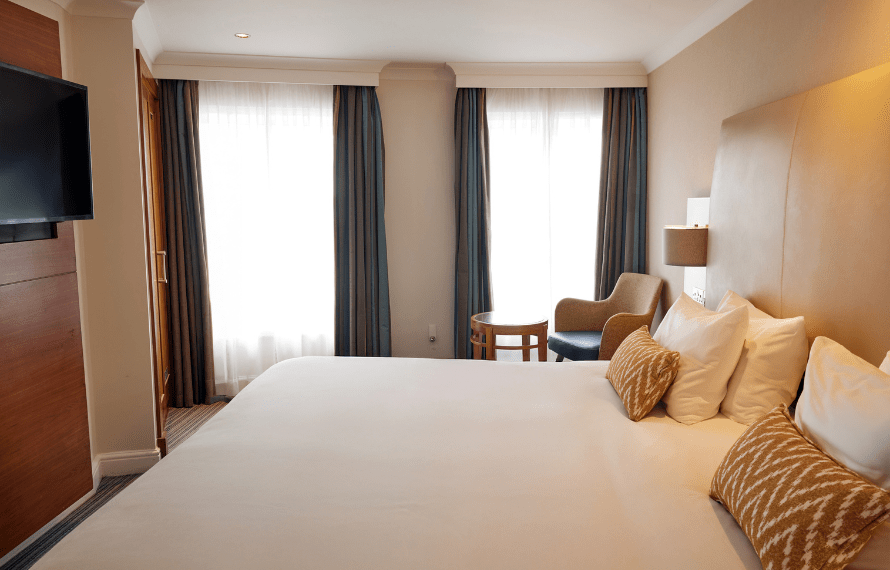 King bed and TV in deluxe king bedroom