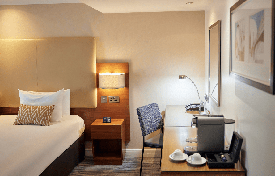 Desk and coffee machine in deluxe king bedroom