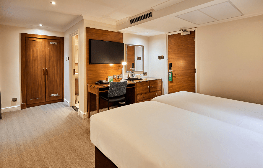 Twin beds, desk and TV