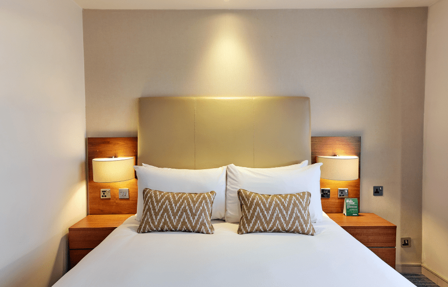 View of the bed in the double room with bedside tables